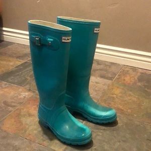 Lightly worn hunter boots.